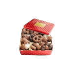Red tin box filled with assorted chocolates and pretzels