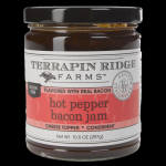 Jar of hot pepper bacon jam with a black lid