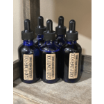 Five blue dropper bottles labeled liquid flower food