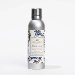 Silver room spray bottle with a floral label