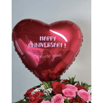 Heart-shaped red anniversary balloon above a bouquet of red and pink roses