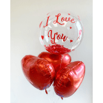 Heart-shaped balloons with a clear balloon reading "I Love You"