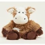 Brown and white plush cow toy sitting against a plain background