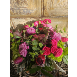 Bouquet of pink roses and purple chrysanthemums with mixed greenery