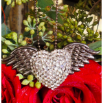 Red roses with a jeweled winged heart pendant