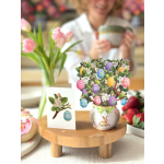 Easter-themed floral card and potted arrangement with painted eggs