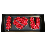 Black gift box spelling I heart U with red roses and tiny string lights