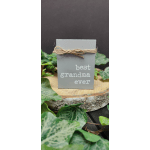 Gray sign with twine reading best grandma ever, surrounded by ivy