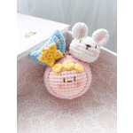 Crocheted bunny and star charms in a gift box