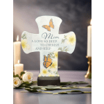 Cross-shaped memorial plaque with butterflies and flowers reading "Mom"