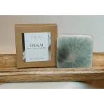 Boxed body and hand soap bar beside a green soap bar