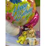Birthday balloons with two small teddy bears