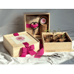 Wooden gift boxes with seedling pots, ribbon, and scissors
