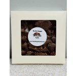 Box of milk chocolate turtles with a clear window