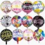 Assorted round birthday balloons with colorful printed messages.