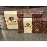 Two boxed chocolate gift sets with brown swirl packaging