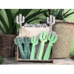 Cactus-shaped nail files displayed in a wooden holder