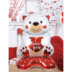 Large teddy bear balloon holding a heart with "love you" text