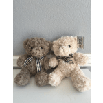 Two plush teddy bears with plaid bows sit side by side.