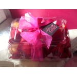 Gift box of red roses tied with a pink ribbon