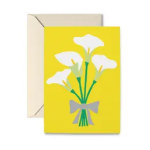 Yellow card with white calla lilies and a gray bow, shown with an envelope
