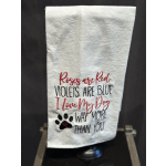 White embroidered towel with a dog-themed quote and paw print