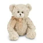 Cream teddy bear with a beige ribbon bow