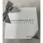 White chocolate gift box with a gray ribbon bow