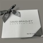 White chocolate gift box tied with a gray ribbon
