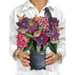 Bouquet of dark purple flowers with butterflies in a black vase