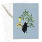Birthday card with a bear holding yellow flowers