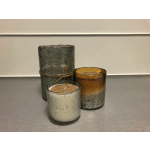 Three scented candles in glass holders, one wrapped in twine