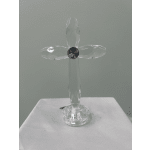 Clear crystal cross figurine on a white cloth