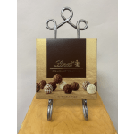 Box of Lindt gourmet truffles on a metal stand