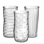 Three clear glass vases with different textured surfaces