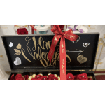 Black Valentine’s Day gift box with red roses and a red ribbon