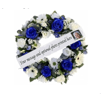 Blue and white floral wreath with a printed message ribbon