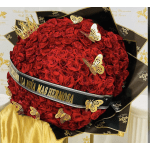 Large heart-shaped bouquet of red roses with gold butterfly decorations