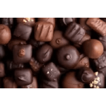 Assorted chocolate truffles and candies in brown tones