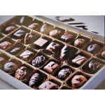 Box of assorted chocolates in a divided tray