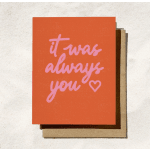 Orange greeting card with pink text reading "it was always you" and a heart