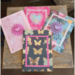 Four decorated handmade greeting cards with butterfly and floral patterns
