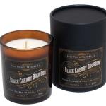 Two black cherry bourbon candles in amber and black containers