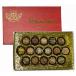 Box of assorted chocolates with a red lid and gold tray