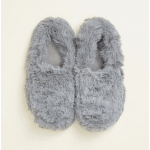 Pair of gray fuzzy slippers on a light background