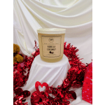 Vanilla coconut scented candle in a frosted jar with red heart decorations