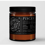 Amber jar candle with a black Pisces label