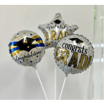 Three graduation balloons with congratulatory text and star designs