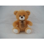 Small brown teddy bear with a ribbon bow