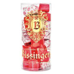 Clear cylinder of assorted red and pink wrapped chocolates